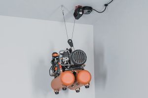 Garage Smart - Basic Lifter hoisting a compressor